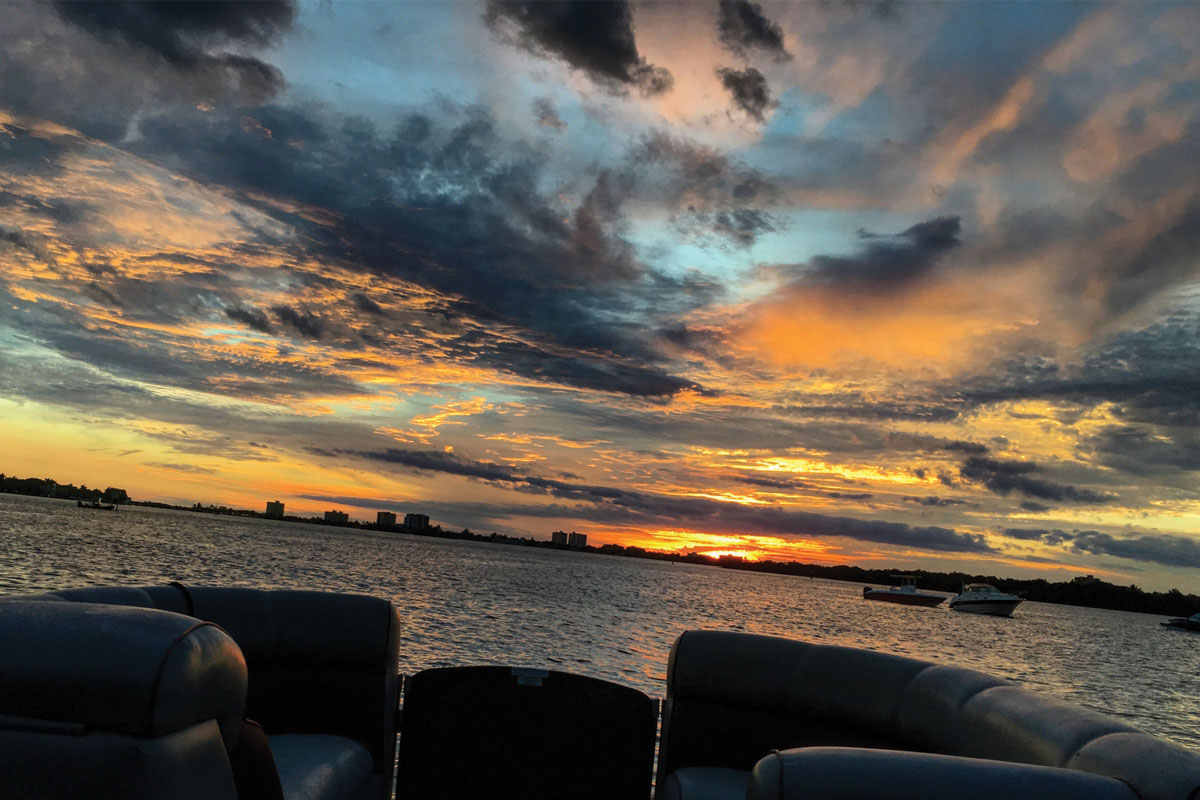 Golden sunset views from Haulover Sandbar Miami during a sunset sip and cruise boat tour